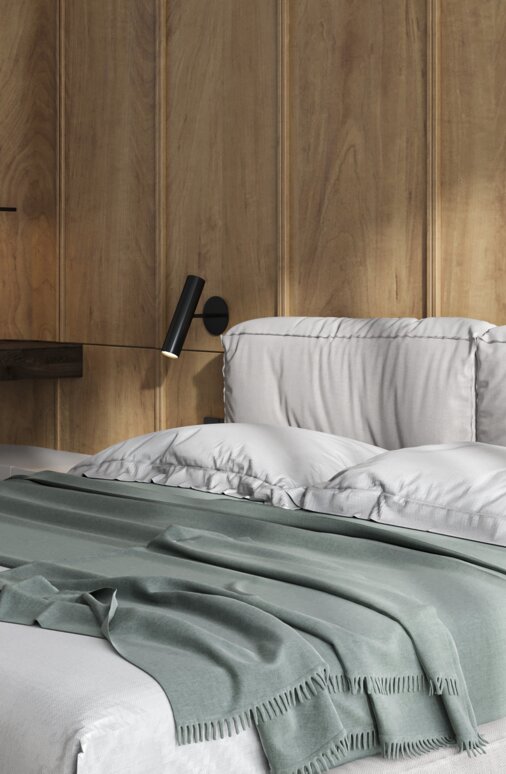 Gemütliches Schlafzimmer mit Holzwand, Bett und Schreibtisch.
